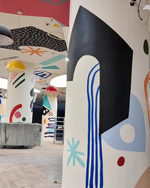 Colorful pillars and ceiling in indoor space.