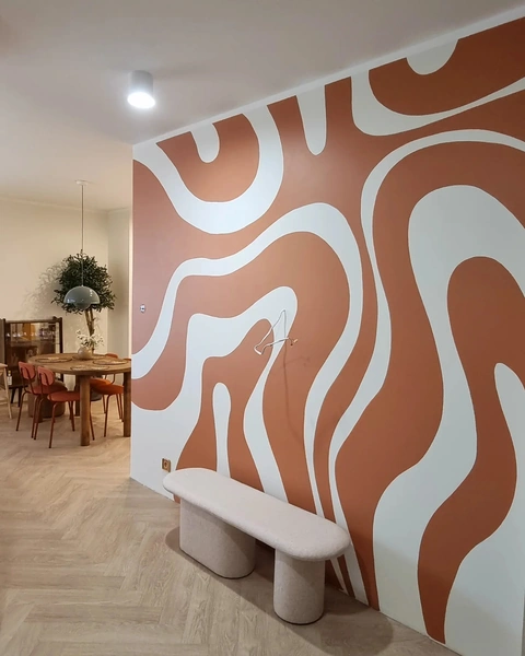 Modern interior with abstract wall art and dining area.